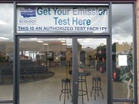 Emissions Test Signage in front of the center