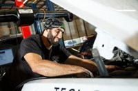 PTAC employee repairing vehicle