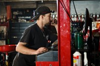 PTAC employee running diagnostics on car