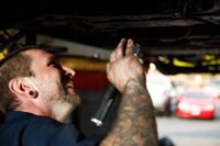 PTAC employee repairing vehicle