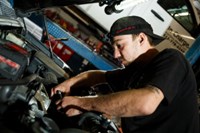 PTAC employee repairing vehicle