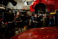 PTAC employees repairing vehicle