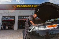 Certified PTAC technician inspecting a vehicle