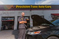 Certified PTAC technician inspecting a vehicle