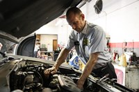 PTAC employee repairing vehicle