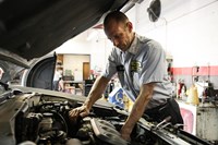 PTAC employee repairing vehicle