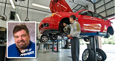 PTAC employee repairing a car